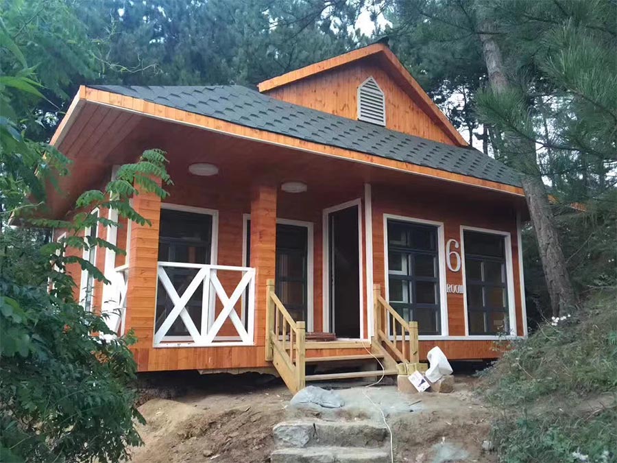 Mountain-Integrated Small Wooden House Blends with Forest Environment